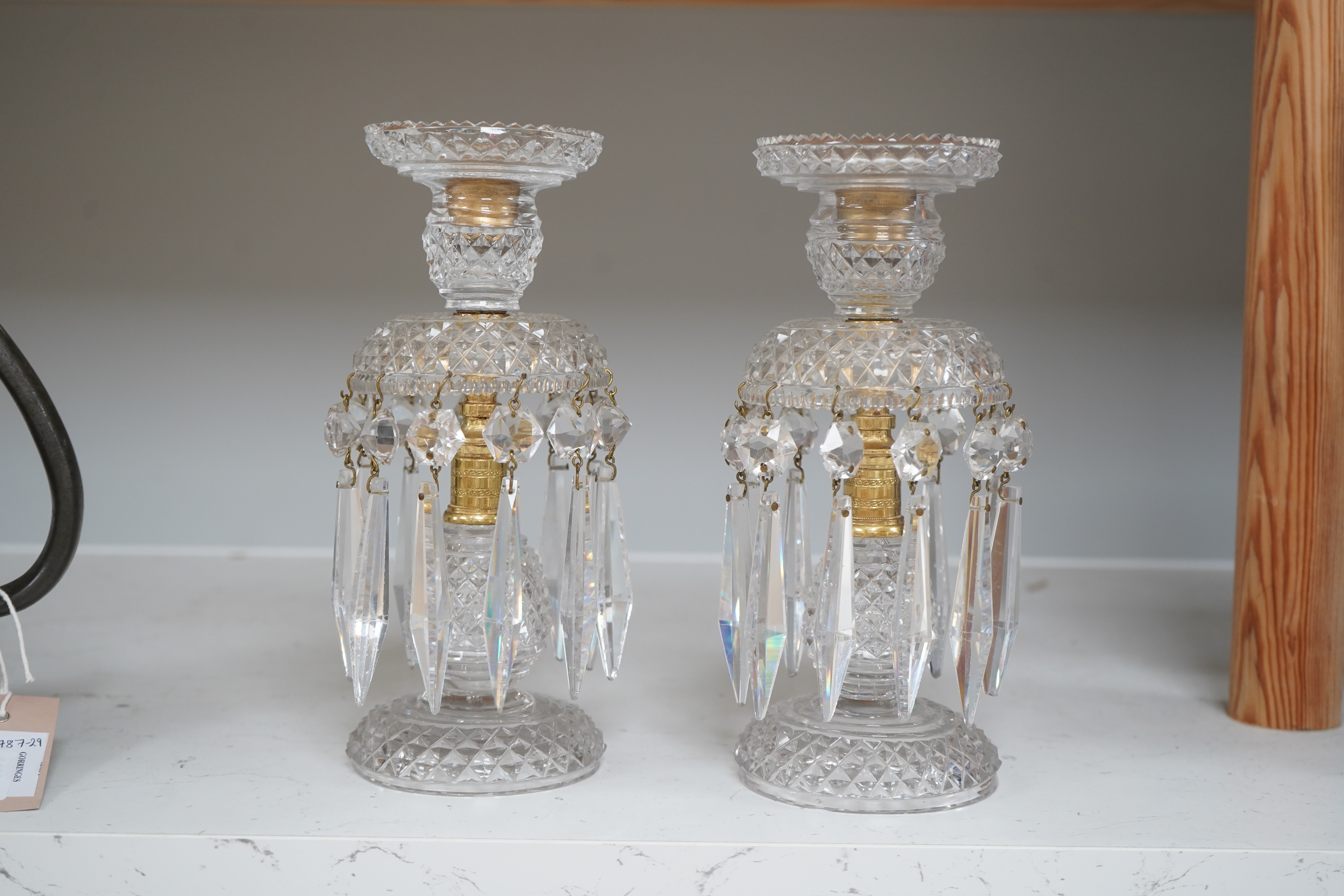 A pair of Victorian cut glass and gilt metal table lustres, 21.5cm. Condition- minor nicks